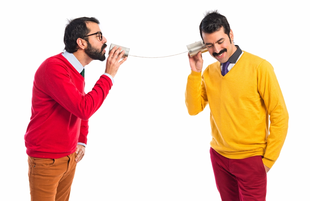 Twin Brothers Talking Through Tin Phone